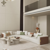 Chinesischer Hersteller: 10-Sitzer Wohnzimmermöbel, Modernes Luxus-Stoffsofa-Set mit geschwungener Form und Metalldekoration