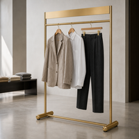 Porte-vêtements en métal doré, sur pied, pour boutique de vêtements, fabrication sur mesure pour magasins de détail