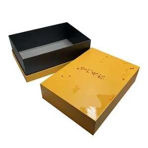 Tapa de caja de regalo de embalaje de papel de cartón con logotipo en relieve amarillo y caja base para caja de té