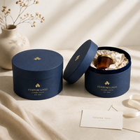 Caja Redonda de Cartón Rígido Reciclable Personalizada, Color Azul Marino, con Logotipo Estampado en Lámina, para Empaque de Productos de Cuidado de la Piel de Lujo