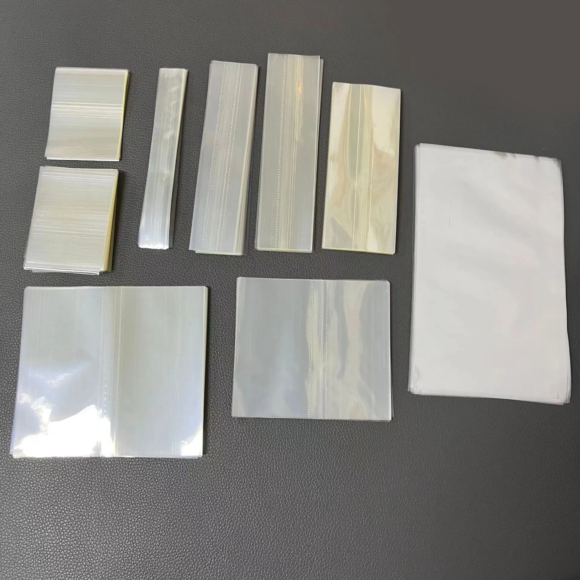Plastik POF PVC PET Heat Shrink Band Clear Shrink Wrap Film Sleeve untuk Produk Kosmetik