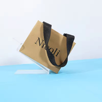 Sacs de shopping en papier kraft de luxe en gros, logo personnalisé, style classique, gaufrés, avec poignée, pour l'emballage de cadeaux