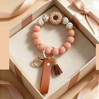 Silikonperlen-Schlüsselanhänger-Armband mit Gänseblümchen-Design, PU-Leder-Quastenband und Anti-Verlust-Funktion