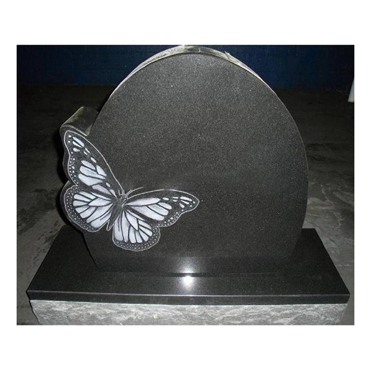Гранитный надгробный камень с бабочкой