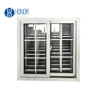 Fenêtre coulissante en verre double UPVC avec conception de gril comprenant une moustiquaire pour une sécurité et un confort améliorés à la maison