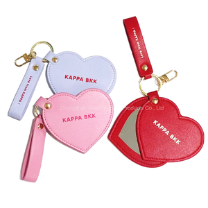 Rotatable Heart Design Advertising Gifts Custom Logo Label PU Leather Pocket Mirror with Keychain for Travel Makeup