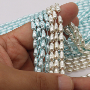 Cuentas de vidrio premium con núcleo pesado, forma Petite Marquise, color Azul Glaciar y Blanco Marfil, con textura de hilo, para DIY estilo Mermaidcore - Product Image 6