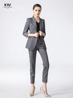 Costumes d'affaires pour femmes à rayures gris foncé personnalisés Costume de travail professionnel avec décoration de bouton Nouvelle méthode de tissage non tissé