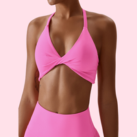 Beau soutien-gorge de sport torsadé sur le devant Sangle respirante élastique à séchage rapide Coussin de poitrine amovible Soutien-gorge de sport Sexy Cross Back Soutien-gorge de sport