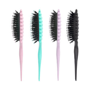 Pinceau à boucles définissantes avec broches pour réduire la séparation des cheveux bleus et définir les cheveux bouclés. - Product Image 1