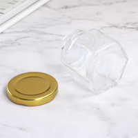 Bocaux à miel hexagonaux transparents bouteilles en verre de miel uniques ou bocaux en verre hexagonaux pour miel
