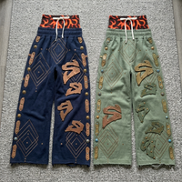 Pantalon de survêtement large à double ceinture imprimé flamme avec motif diamant vintage, ourlet effiloché, style streetwear, taille élastique