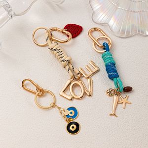 Fashion Luxury Gold Alloy Bag Charms Car Key Chains Woven Rope Heart Metal Letter Charms Women Jewelry Gifts Keychain