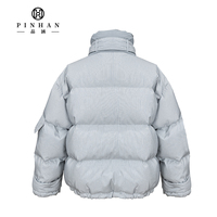 Veste matelassée courte à rayures pour femme avec col montant à nœud papillon et poches cargo