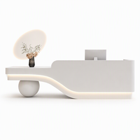 Comptoir de réception incurvé moderne et luxueux, blanc, sculptural, avec éclairage LED pour salon de beauté, boutique, hôtel