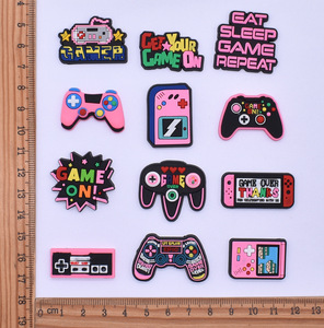 Venta al por mayor de dibujos animados de PVC de plástico suave parche DIY accesorios de la caja del teléfono celular con música y estilos religiosos zapatos de muñeca plana y dijes - Product Image 2