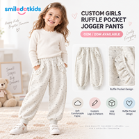Smiledotkids Pantalon de jogging pour enfants gris à imprimé cœurs, poches à volants, en molleton doux, personnalisable OEM ODM, faible MOQ, vente en gros