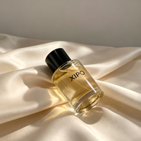 Flacon de parfum en verre transparent rond de haute qualité OEM 50 ml 80 ml avec vaporisateur à sertir et couvercles noirs de luxe
