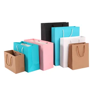 Sac en papier kraft avec logo personnalisé pour vêtements, shopping de parfum, emballage d'aliments, vente en gros, 100 pièces