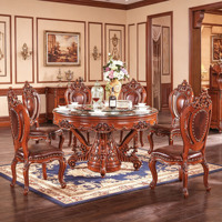 Ensemble de table à manger ronde en bois massif sculpté à la main de style européen de luxe avec plateau tournant en verre et chaises en cuir PU pour villa, vente en gros
