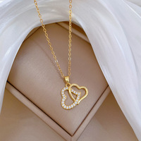 Collier pendentif double cœur plaqué or de luxe, chaîne croisée en acier inoxydable, bijoux de mariage et de fête pour femmes et jeunes filles