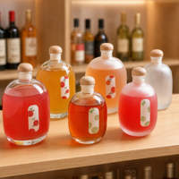 Bouteille à spiritueux ovale en verre borosilicate, forme galet, luxe unique, pour gin et whisky, base lourde avec sérigraphie intégrée