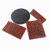 Étiquettes de vêtements D'usine De Forme Faite Sur Commande de Logo De Marque en Cuir Véritable En Relief pour Jeans et Sac