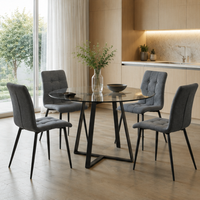 Ensemble de table à manger moderne de luxe avec chaises en tissu gris, structure en fer, plateau rond en verre écologique pour salle à manger et hôtellerie