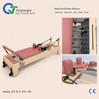 Appareil de Pilates Reformer en bois d'érable à rail fixe avec revêtement rose poudré pour studio de boutique