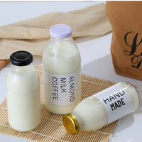 En stock, bouteilles en verre transparentes pour jus, boissons, lait, rondes, vides, de 10 oz, 12 oz, 16 oz, avec couvercle et logo personnalisé