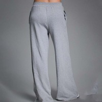 Pantalon de survêtement décontracté pour femme avec logo OEM, taille élastique avant, jambes larges, poches latérales, coupe décontractée, doux, respirant et extensible pour le quotidien