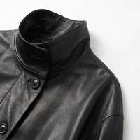 Veste en cuir de mouton noir vintage pour femme, col montant, boutons asymétriques, véritable peau de mouton, avec poches zippées