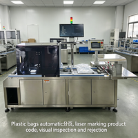 Ligne combinée de marquage laser et d'inspection pour sacs d'emballage en papier avec alimentation automatique, aspiration-soufflage anti-surposition et codage de date dynamique
