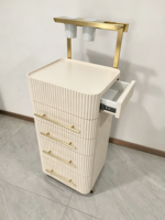 Chariot de rangement mobile pour outils de coiffure au design côtelé moderne avec support pour sèche-cheveux
