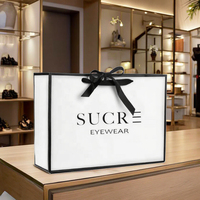 Toptan lüks beyaz karton butik ayakkabı düğün hediye ambalaj için kağıt alışveriş torbası özelleştirilebilir Logo kolu halat
