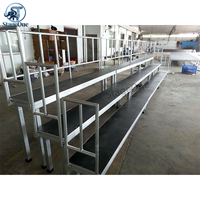 Scène de chorale modulaire à pieds fixes en alliage d'aluminium, stable, avec une capacité de charge de 1000 kg, pour événements scolaires et compétitions