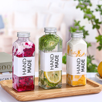 Vente en gros Cmugr1 litre bouteille en verre 12oz 14oz 16oz bouteille de jus boisson carré clair bouchon à vis bouteilles en plastique pour jus BAIDE