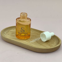 Flacon compte-gouttes en verre noir 30 ml vide pour huiles essentielles et sérums, avec bouchon doré et pompe en caoutchouc blanc, vente en gros, logo personnalisé