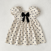 Robe d'été pour filles, imprimé cœur blanc, nœud noir, manches courtes bouffantes, robe de princesse pour tout-petits, mignonne, décontractée, vêtements d'été pour enfants