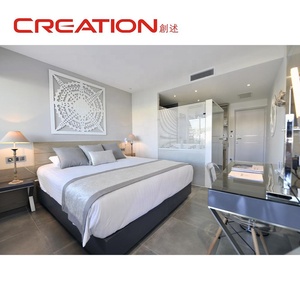 Meubles de suite d'hôtel de luxe, lit capitonné king size avec tables de chevet assorties pour les chambres d'hôtel - Product Image 1