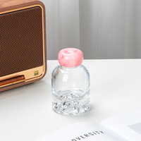 Flacon de parfum en verre transparent à fond concave de luxe 102 ml, logo personnalisable avec bouchon rose
