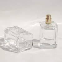 Flacon de parfum carré en verre épais de 100 ml de qualité supérieure, atomiseur de parfum vide en gros, pompe pulvérisatrice électroplaquée or, sérigraphie