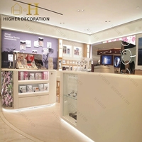 Vitrine de présentation cosmétique haut de gamme en bois massif avec éclairage LED pour comptoir de maquillage