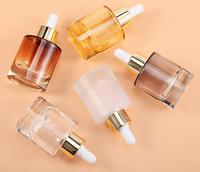 Conteneur de bouteilles cosmétiques de luxe collier en or compte-gouttes de sérum en verre rond cylindrique 30mL 50mL pour les produits cosmétiques de soin