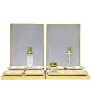 gold plated metal frame brushed background acrylic cosmetics show case with led light