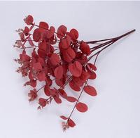 Vente en gros de feuilles d'eucalyptus artificielles multicolores en plastique non tissé de haute qualité Dongchen, fabriquées à la main, à 16 branches, pour la décoration