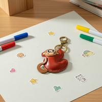 Porte-clés singe mignon sculpté en cuir véritable fait main Weilei, forme irrégulière, tannage végétal, pendentif de sac personnalisé, décoration quotidienne