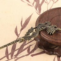 Vente en gros d'épingles à cheveux de dragon rétro créatives personnalisées, aiguille à cigare de dragon portable, artisanat en cuivre