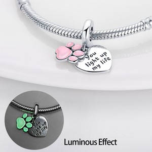 This white brass <b>bracelet</b> features enamel <b>flowers</b> and stars, glows in the dark, and its cute style makes it a perfect gift - Product Image 3