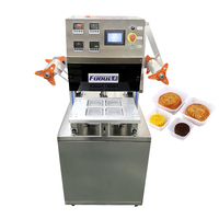 Machine d'emballage à atmosphère modifiée pour gâteau de lune Machine à sceller les aliments soufflé Scellant automatique à l'azote pour pâtisserie